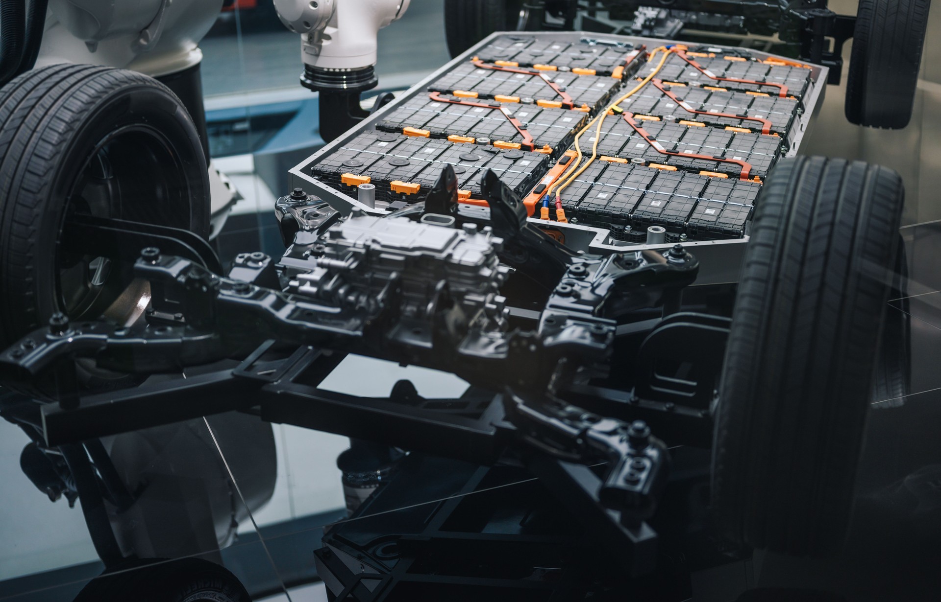 exposed ev battery pack on vehicle platform with robotic installation