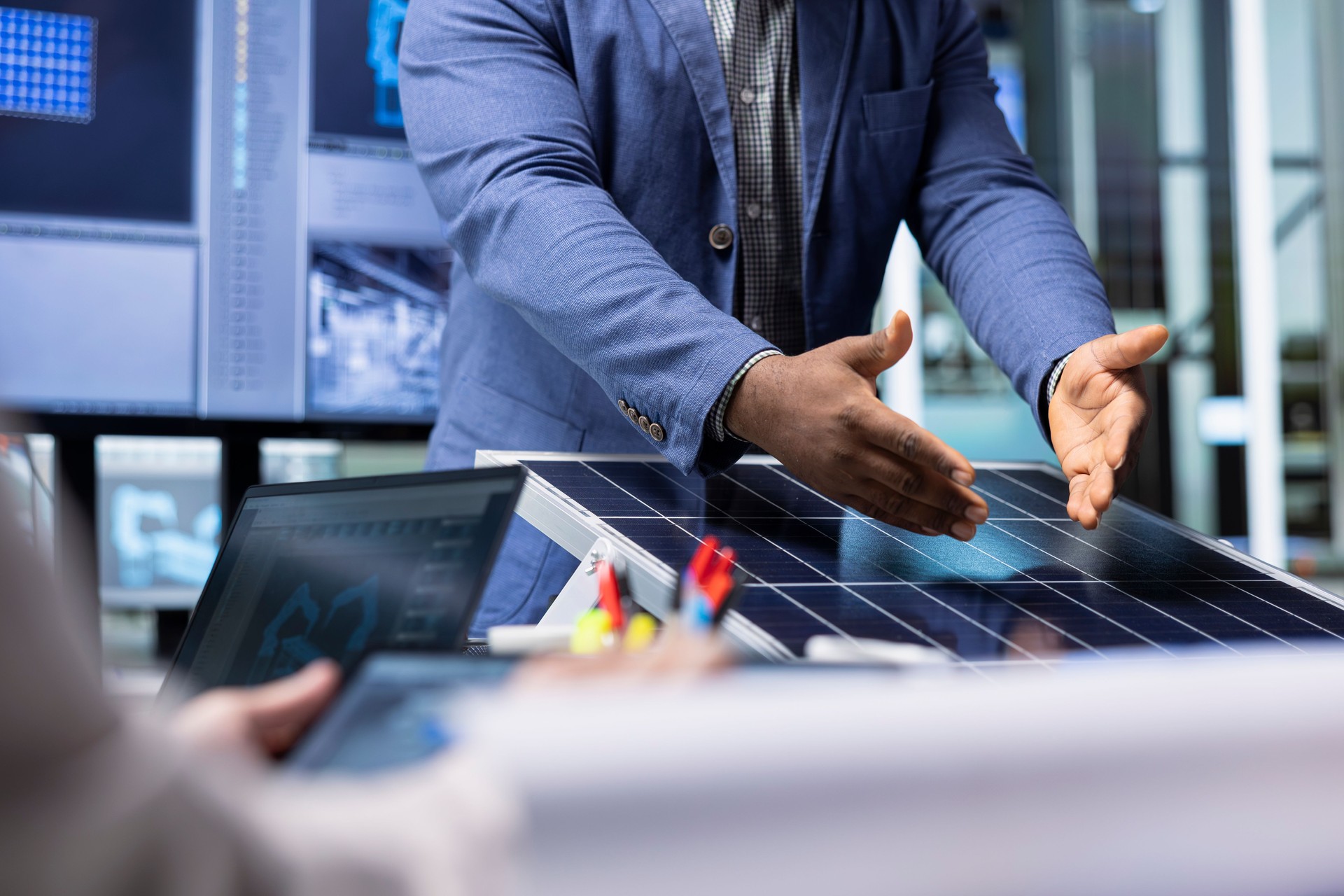 Factory investors meeting to chat about technical improvements to solar cells