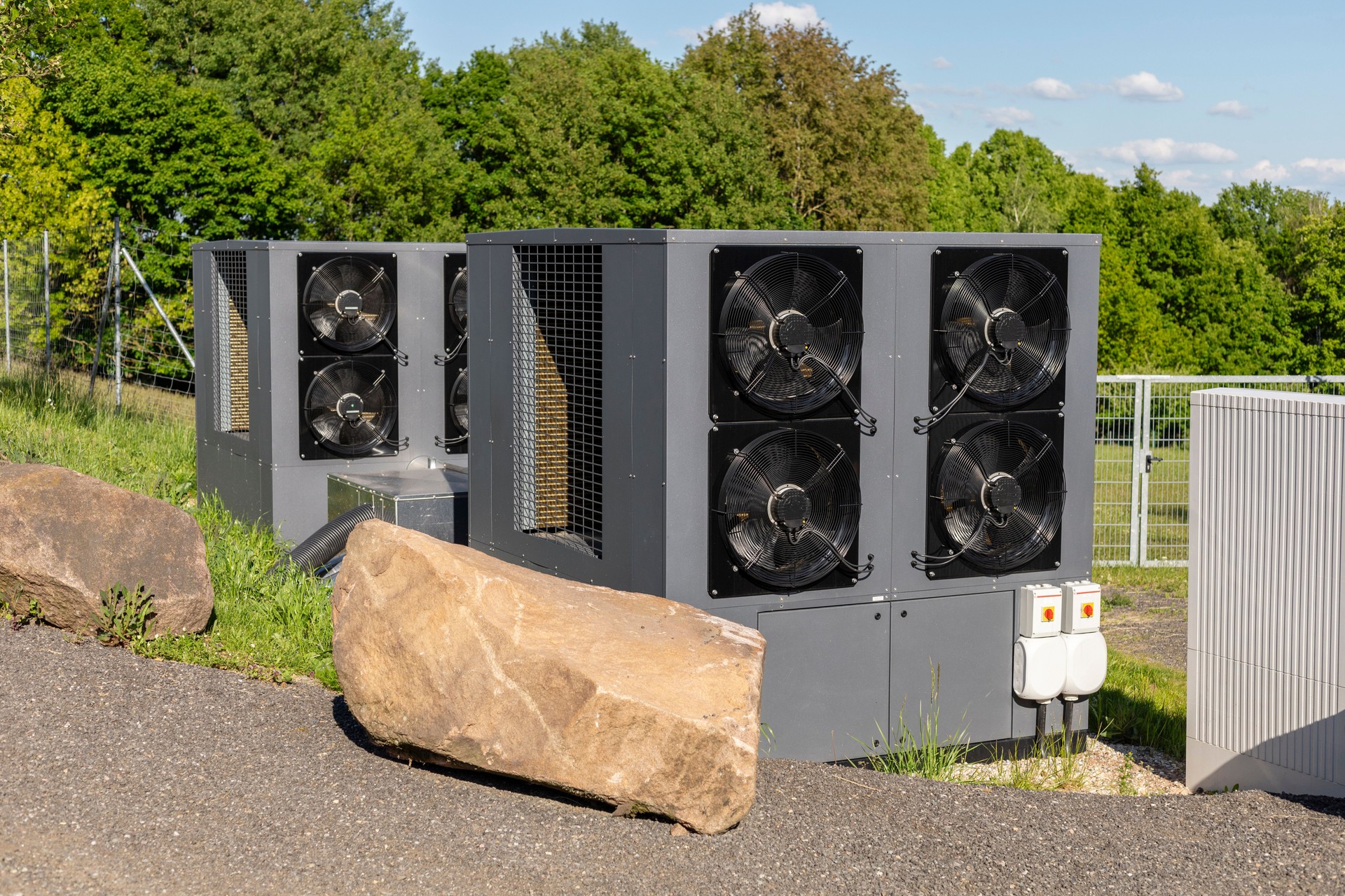 Commercial air source heat pump system installed outdoors. These systems are common in energy-efficient HVAC solutions and are increasingly used in modern sustainable architecture.